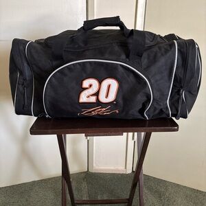 Sleek Black Duffel Bag with Durable Fabric and Spacious Design